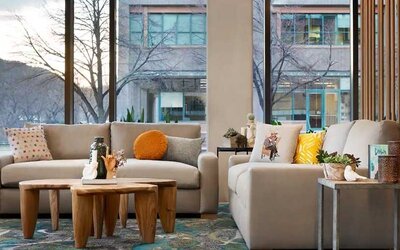 comfortable lobby lounge area with natural light ideal for coworking at Embassy Suites by Hilton Boulder.