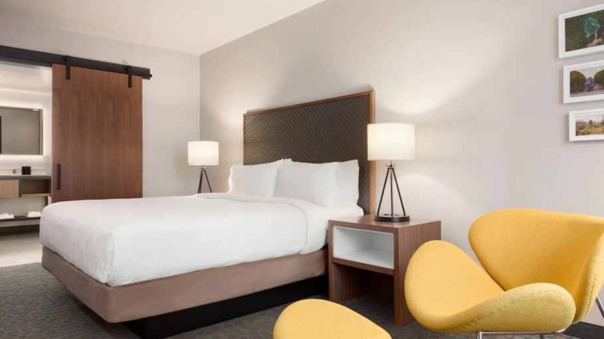 beautiful king room with lounge area at Hilton Garden Inn Boulder.