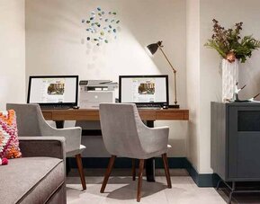 well-equipped business center with internet, printer, and work desks ideal for remote work at Hilton Garden Inn Boulder.