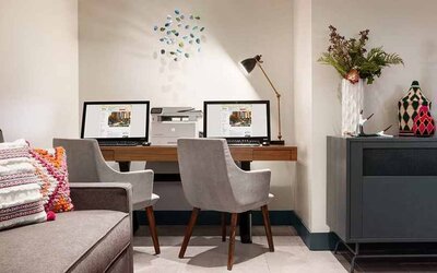 well-equipped business center with internet, printer, and work desks ideal for remote work at Hilton Garden Inn Boulder.