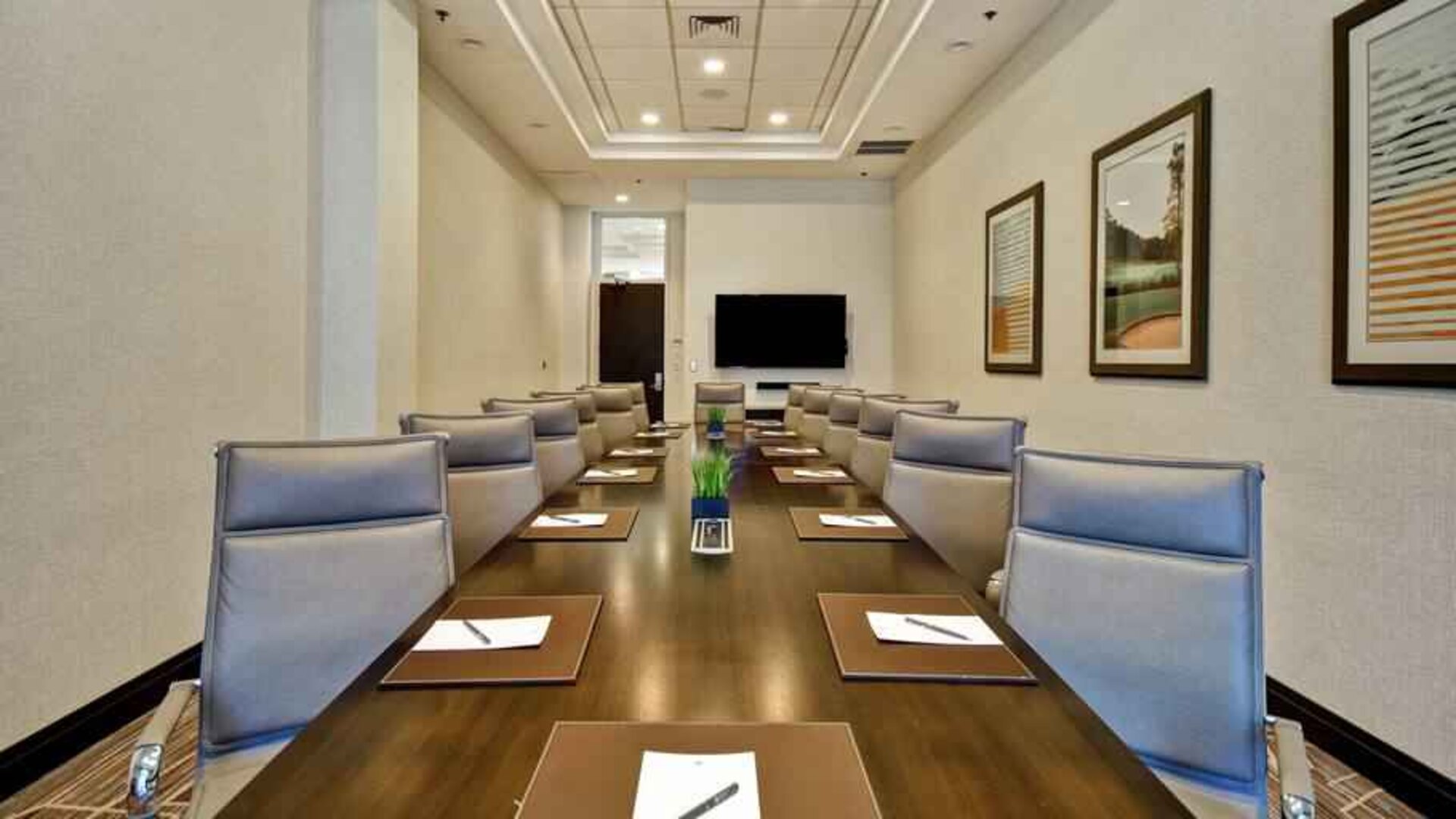 Elegant meeting room with comfortable chairs at the Embassy Suites by Hilton Greenville Golf Resort Conference Center
