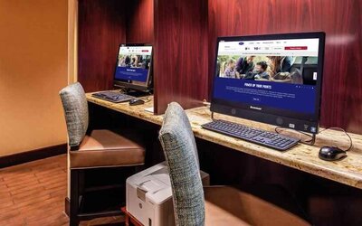 Working station with computers and printer at the Hampton Inn Albuquerque, University-Midtown (UNM).