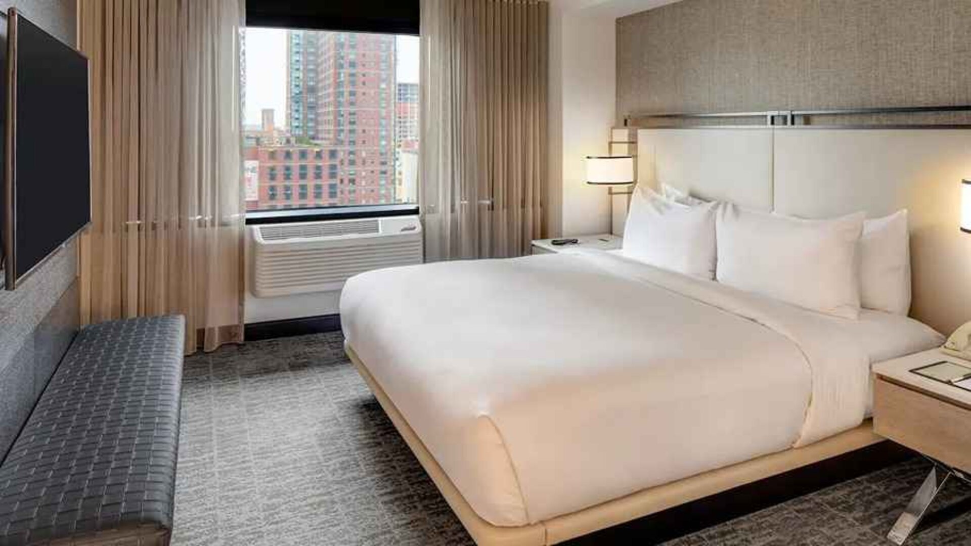 relaxing delux king room with TV at DoubleTree by Hilton Hotel & Suites Jersey City.