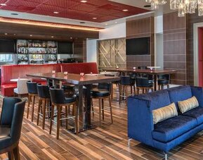 spacious lounge area ideal for coworking at Embassy Suites by Hilton Seattle Downtown Pioneer Square.