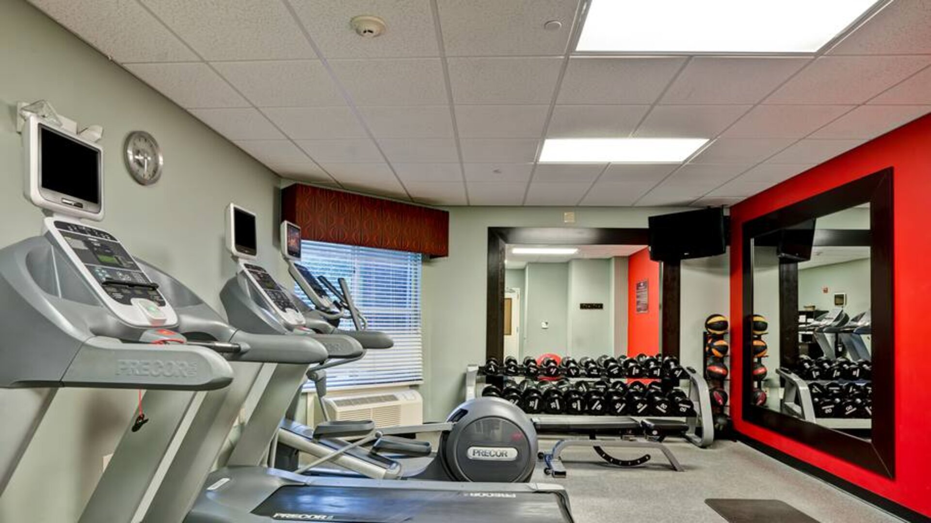 Weights and treadmills at the fitness center of the Homewood Suites by Hilton Bel Air.