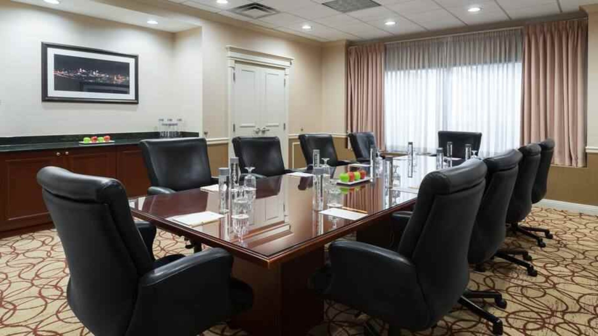 Elegant meeting room with comfortable chairs at the DoubleTree Suites by Hilton Cincinnati-Blue Ash.
