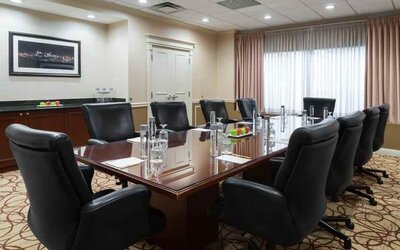 Elegant meeting room with comfortable chairs at the DoubleTree Suites by Hilton Cincinnati-Blue Ash.