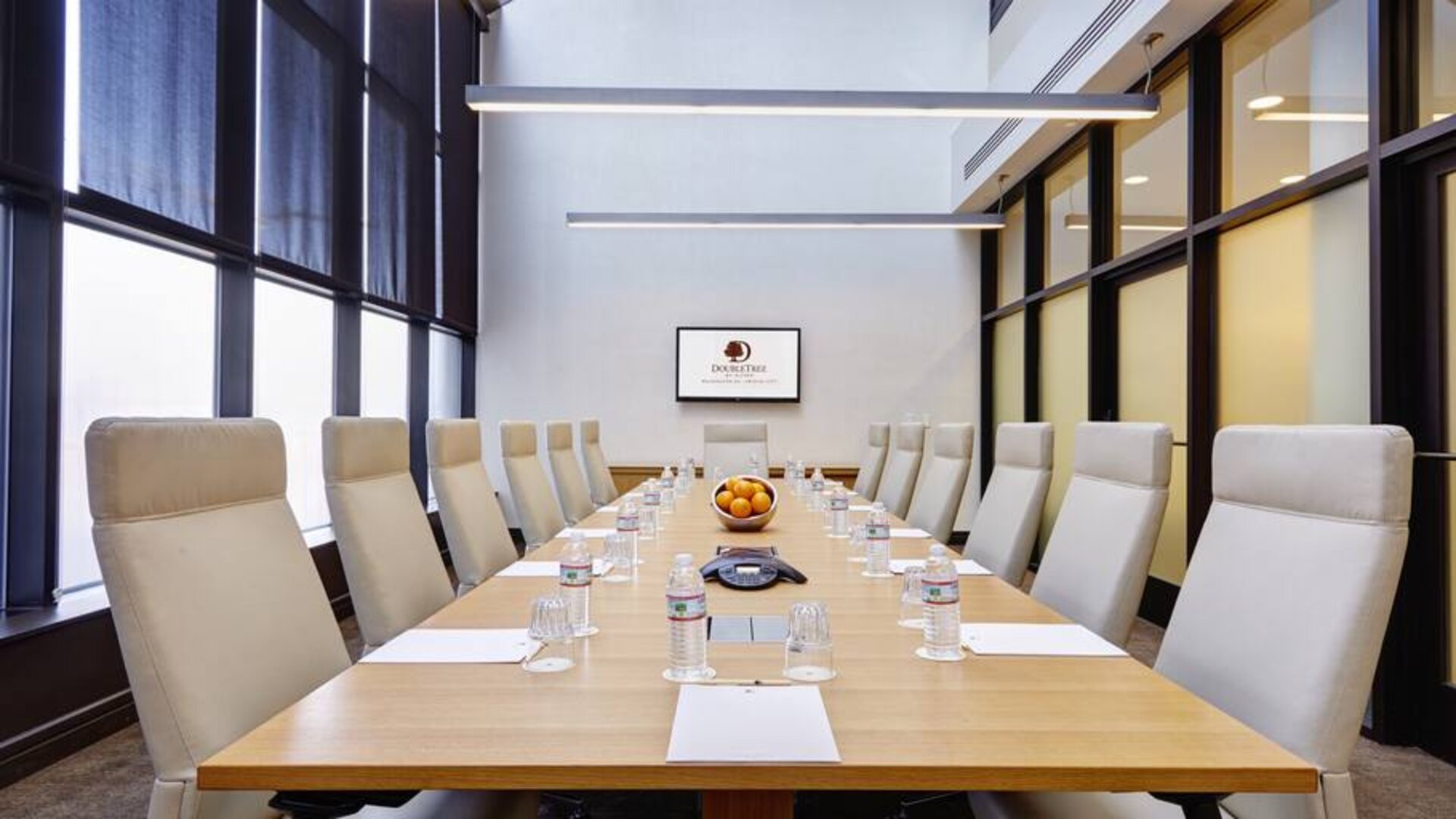 Small meeting room with TV screen at the DoubleTree by Hilton Washington DC - Crystal City.