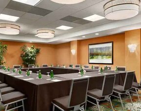 Meeting room with square conference table at the DoubleTree Suites by Hilton Orlando - Disney Springs Area.