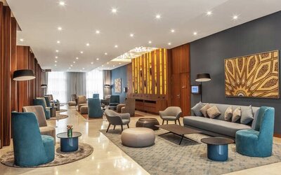 Large open floor plan cowokring lobby with art and wood panel installations.