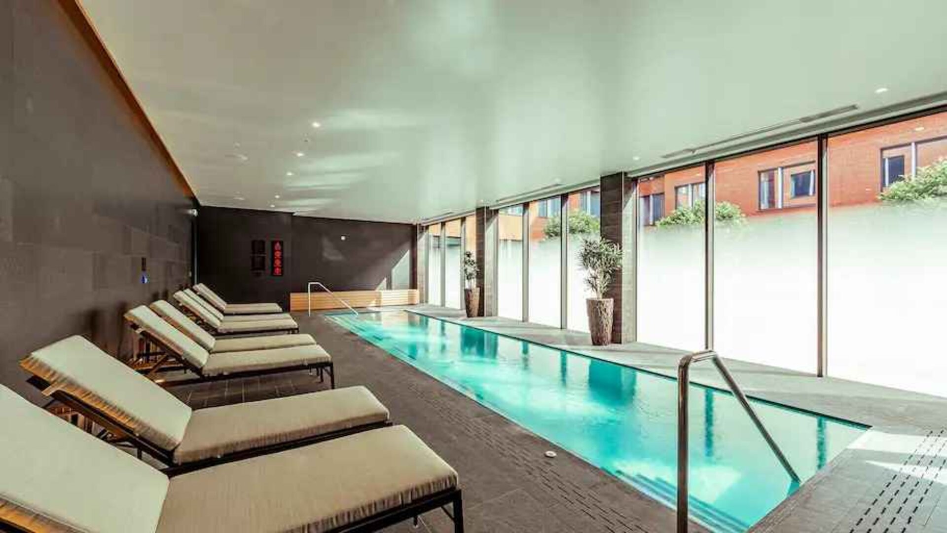 Relaxing indoor pool at the Fellows House Cambridge, Curio Collection by Hilton.