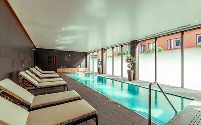 Relaxing indoor pool at the Fellows House Cambridge, Curio Collection by Hilton.