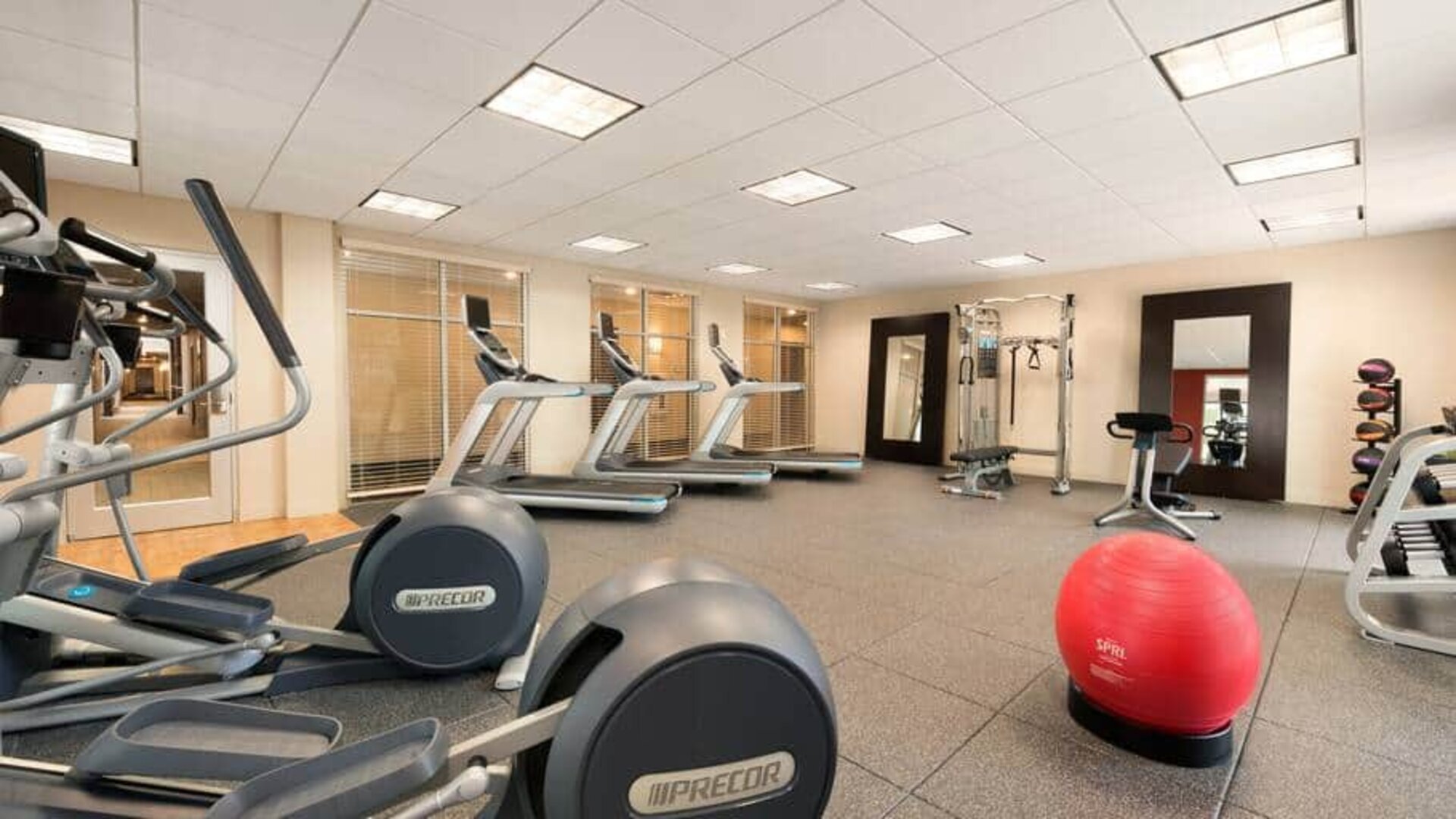 Fully equipped gym with treadmills, elipticals and weight machine at the Homewood Suite by Hilton Atlanta Perimeter.