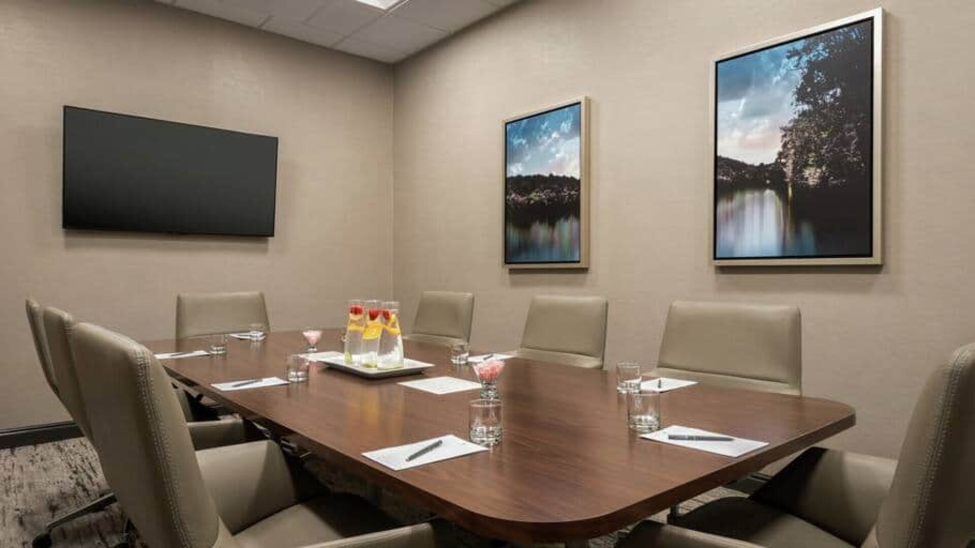 Small and quiet room for any meeting with a mounted tv at the Embassy Suite by Hilton Atlanta Alpharetta