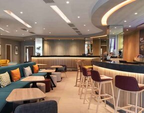 Hotel workspace along the bar at the Hampton by Hilton London Ealing.