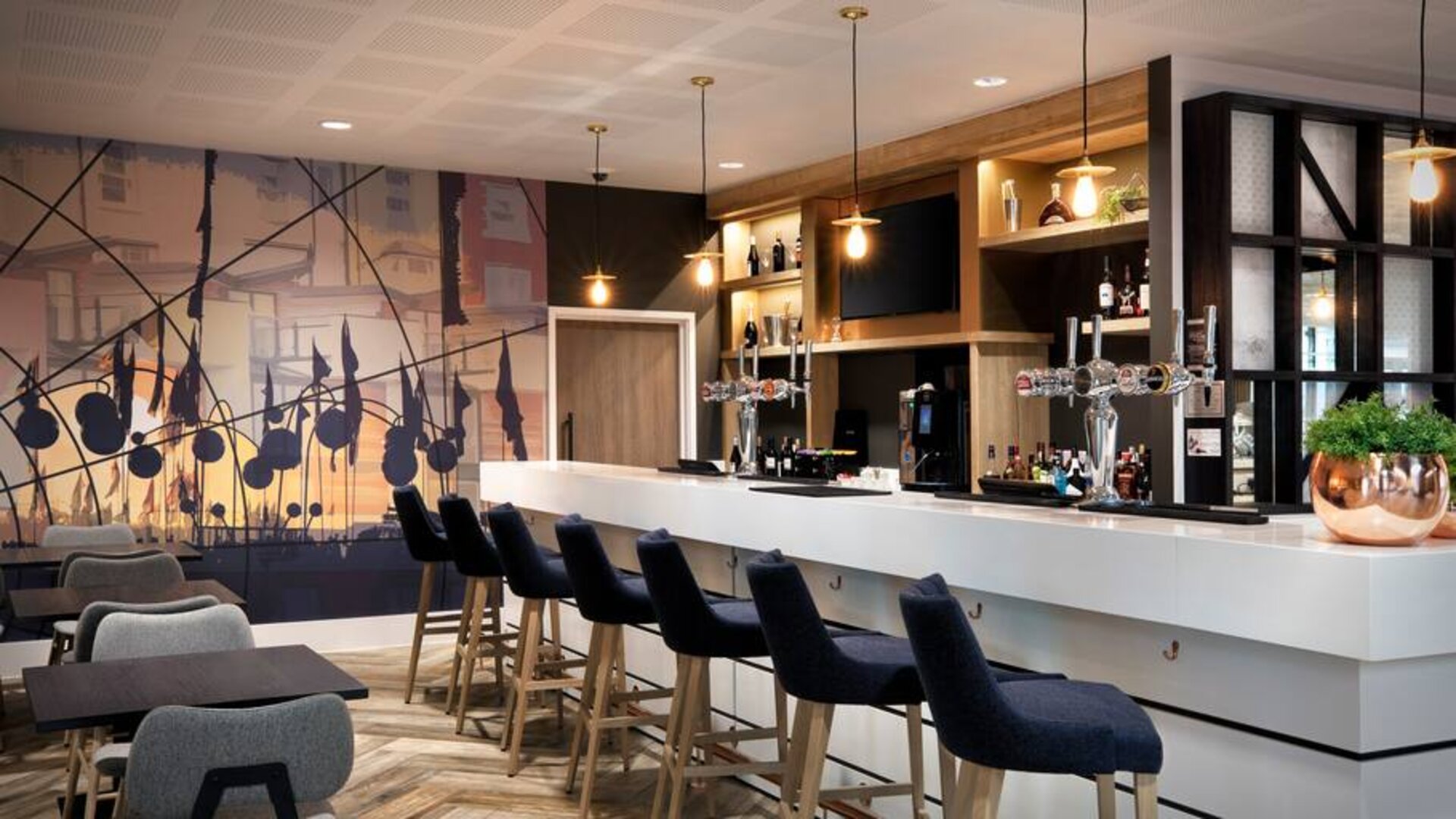 Hotel workspace along the bar at the Hampton by Hilton Bristol Airport.