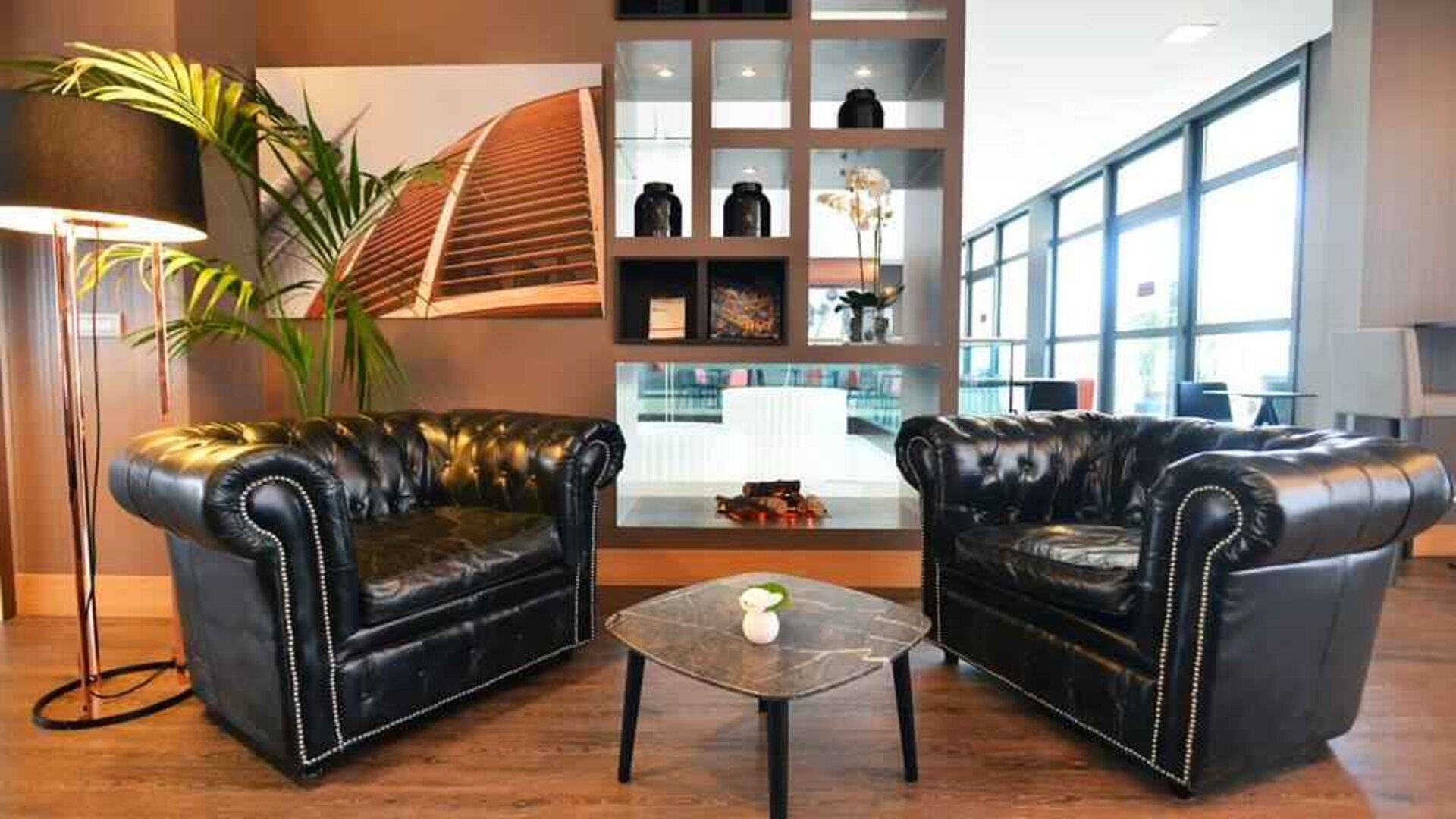 Comfortable hotel workspace with sofas at the Hilton Garden Inn Milan North.