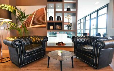 Comfortable hotel workspace with sofas at the Hilton Garden Inn Milan North.