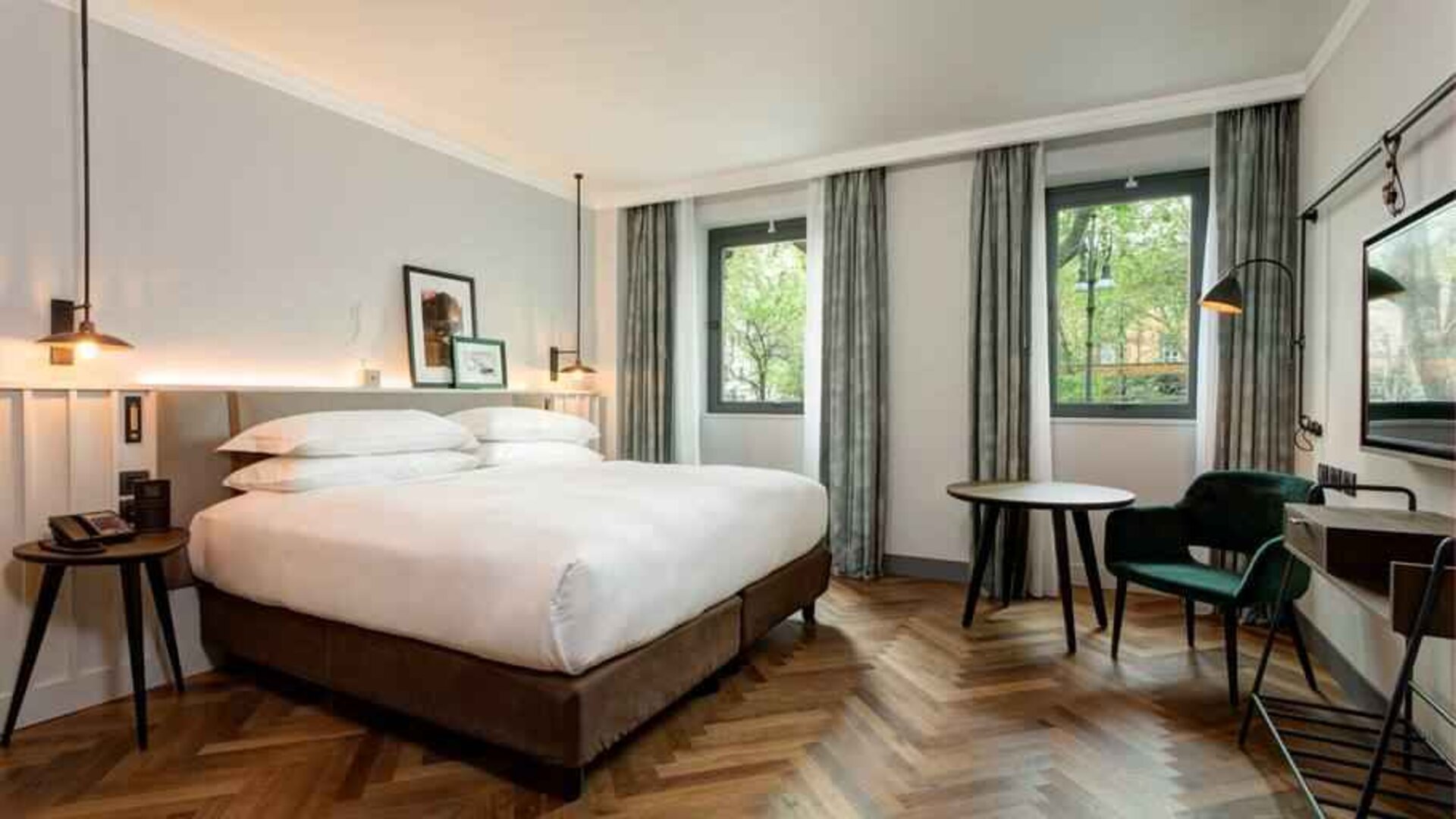 Bright king guestroom with working station at the DoubleTree by Hilton Rome Monti.