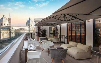 Beautiful outdoor terrace overlooking the city at the DoubleTree by Hilton Rome Monti.