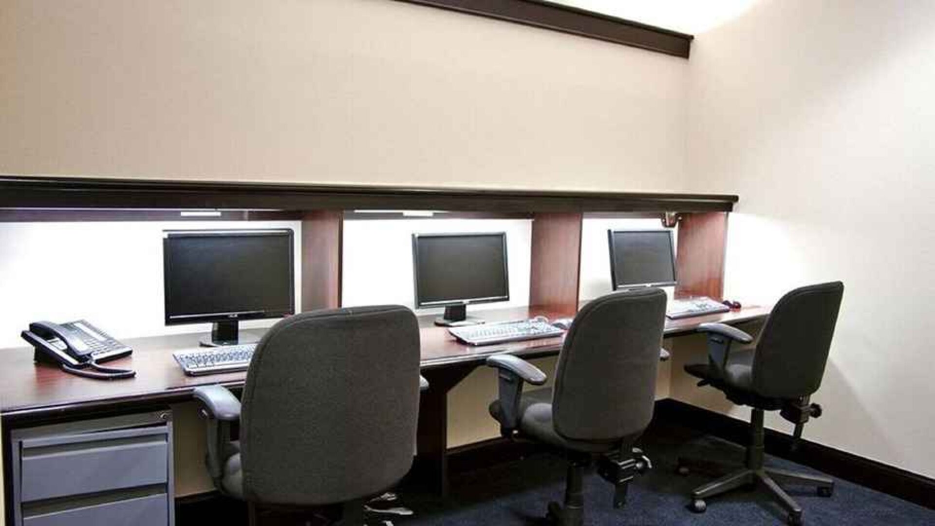 Professional business center with PC, phone, work desks, and printer ideal for working remotely at DoubleTree by Hilton Hotel Downtown Wilmington - Legal District.