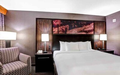 Beautiful king suite with lounge area at DoubleTree by Hilton Hotel Downtown Wilmington - Legal District.