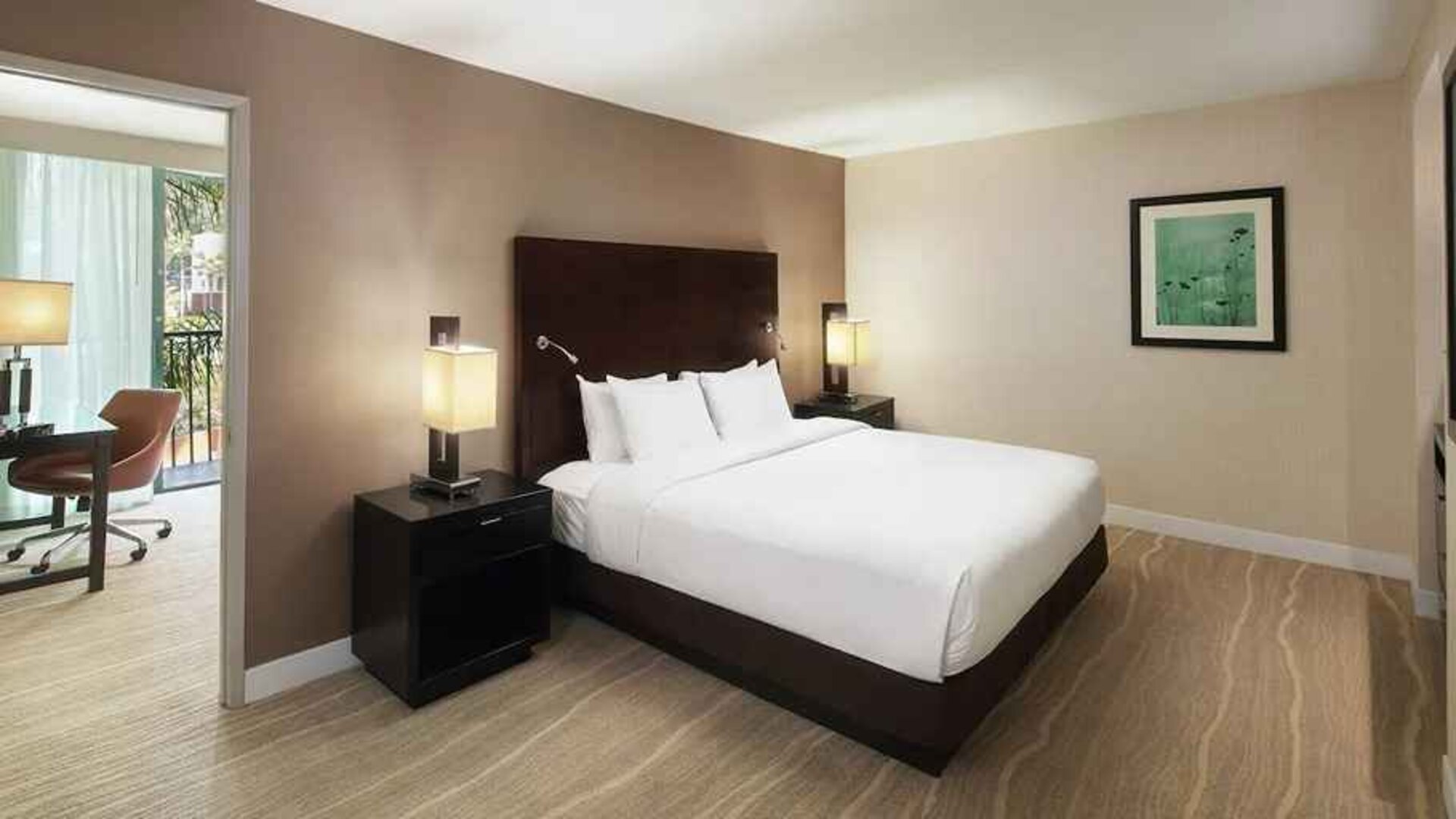 spacious king suite with dedicated work desk ideal for working remotely at DoubleTree by Hilton Hotel San Diego - Hotel Circle.