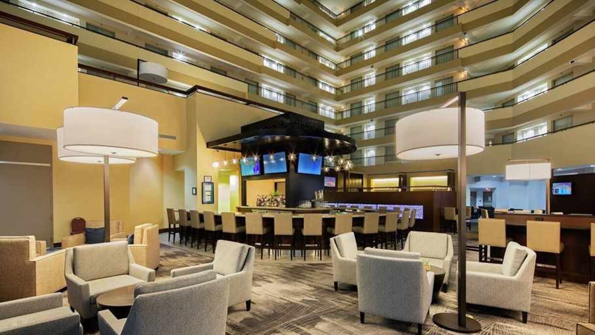 spacious lobby and coworking space ideal for digital nomads at Embassy Suites by Hilton Detroit Troy Auburn Hills.