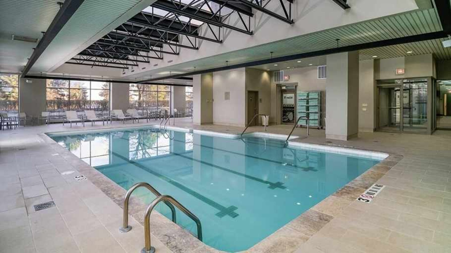 olimpic size indoor pool ideal for swimming laps at Embassy Suites by Hilton Detroit Troy Auburn Hills.