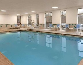 lovely indoor pool with surround seating area at Embassy Suites by Hilton Newark Wilmington South.