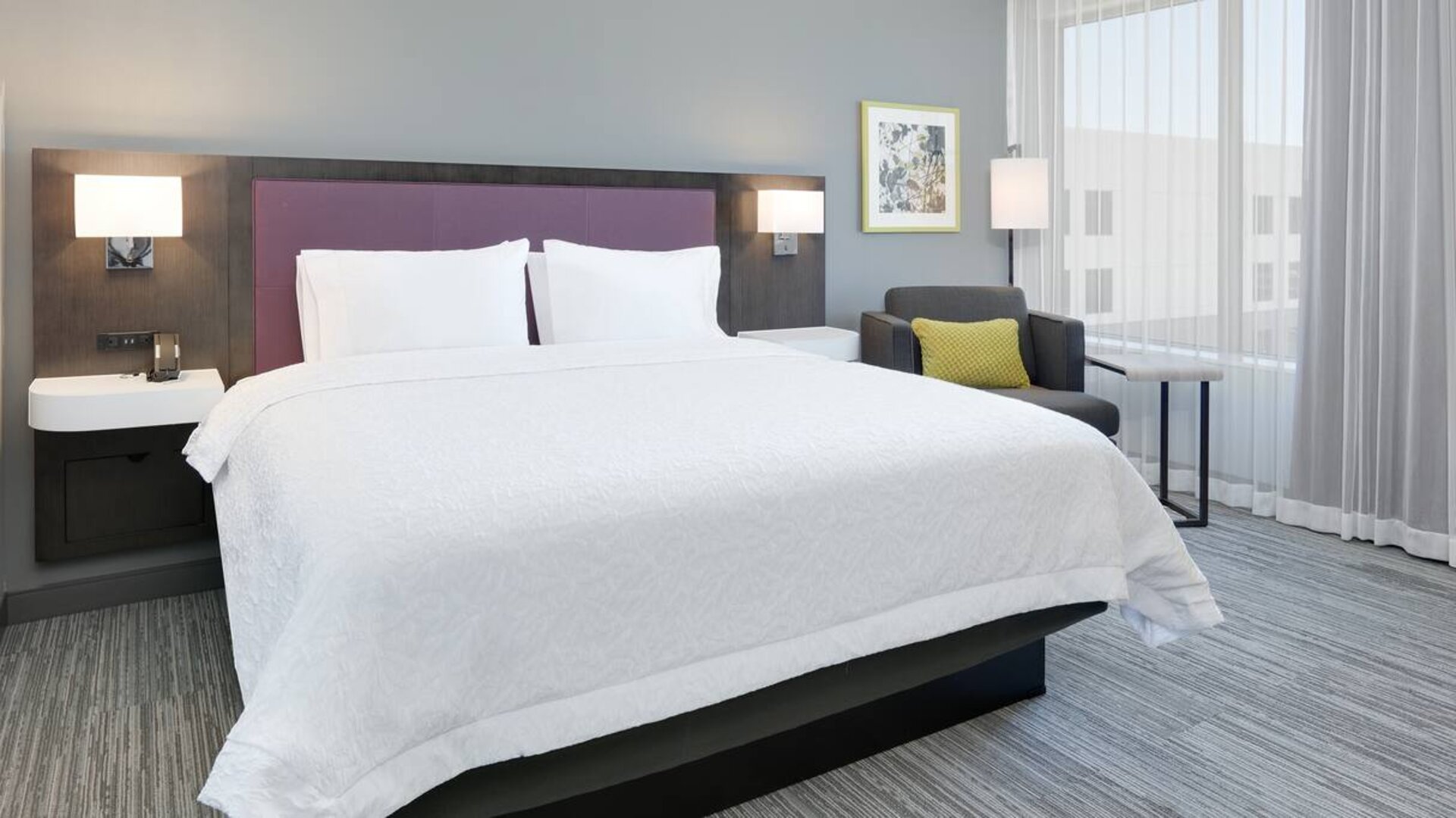 spacious king room with lounger and work area at Hampton Inn Irvine Spectrum Lake Forest.