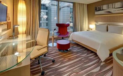 King bedroom with desk at the Hilton Frankfurt Airport.