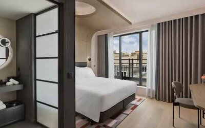 Bright balcony with desk at the Canopy by Hilton Paris Trocadero.