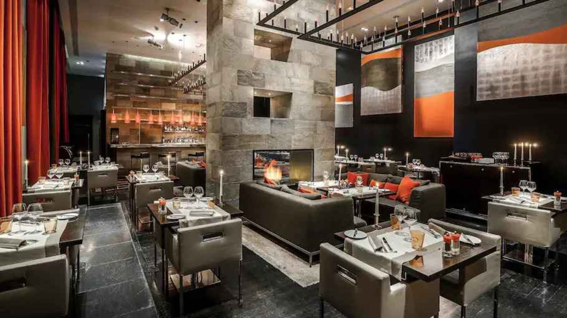 Elegant restaurant with fireplace at the Hilton Evian-les-Bains.