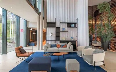 Bright lobby workspace with sofas at the Hilton Evian-les-Bains.