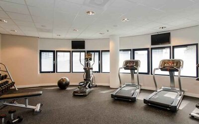 Fitness center with treadmill and machines at the Hampton by Hilton Amsterdam Airport Schiphol.