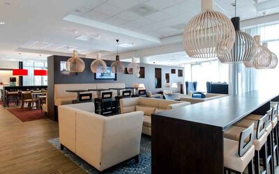 Comfortable lobby workspace at the Hampton by Hilton Amsterdam Airport Schiphol.