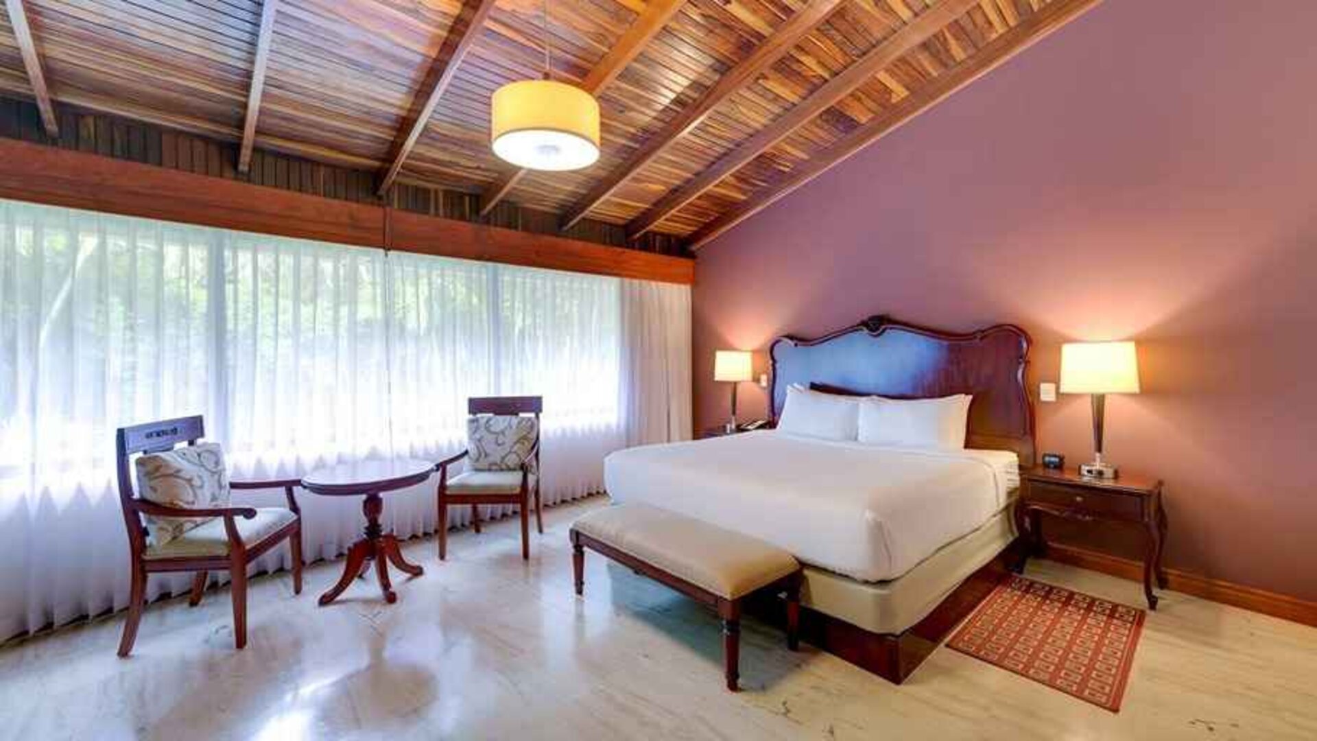 spacious king suite with dining area at DoubleTree by Hilton Hotel Cariari San Jose - Costa Rica.