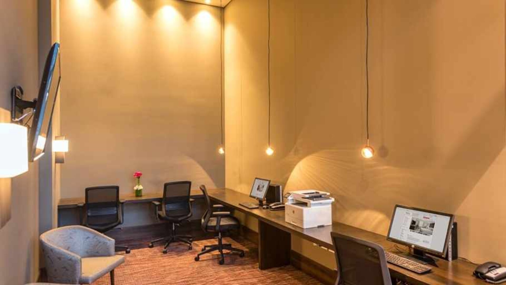 dedicated business center with PC, internet, work desks, and printer at Hilton Garden Inn Bogota Airport.
