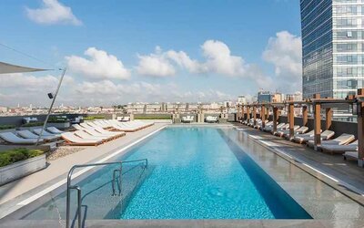 stunning outdoor pool with sun beds at Hilton Istanbul Bomonti Hotel & Conference Center.