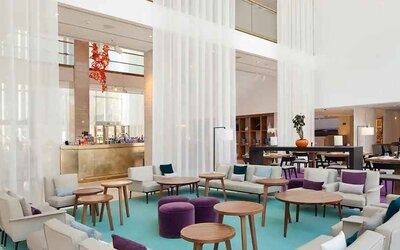 comfortable lobby and coworking space with lots of natural light at Hilton Barcelona.
