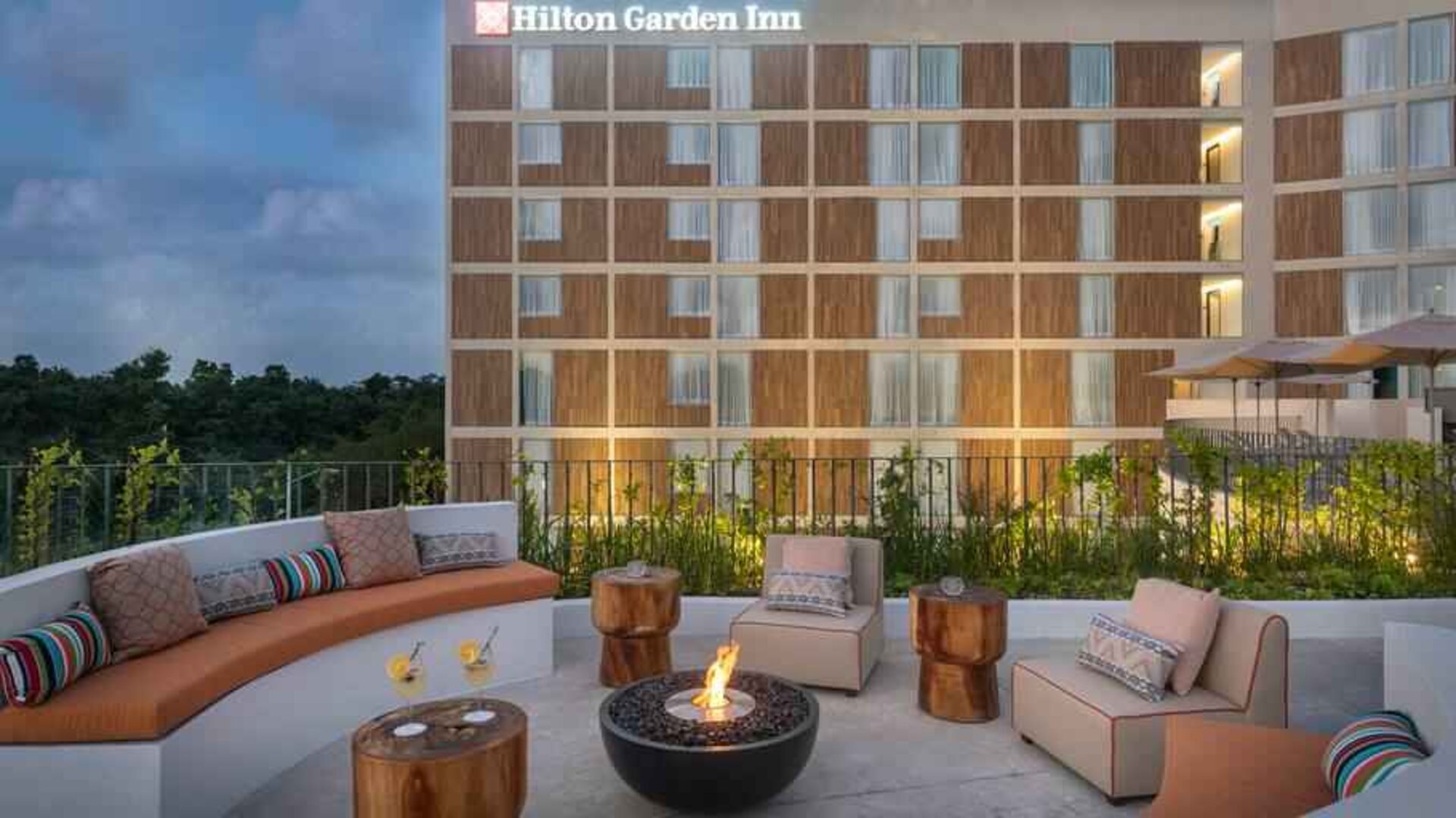 Terrace with firepit suitable for co-working at the Hilton Garden Inn Cancun Airport.