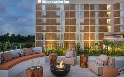 Terrace with firepit suitable for co-working at the Hilton Garden Inn Cancun Airport.