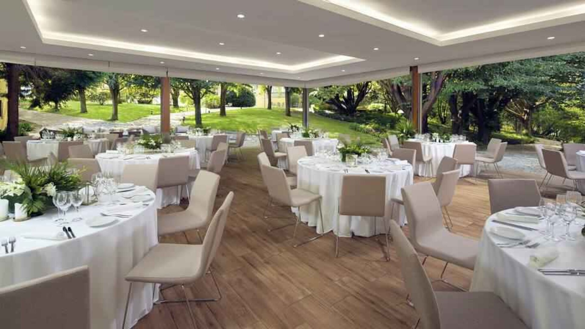 Dining area set in a beautful garden at the Boeira Garden Hotel Porto Gaia, Curio Collection by Hilton.