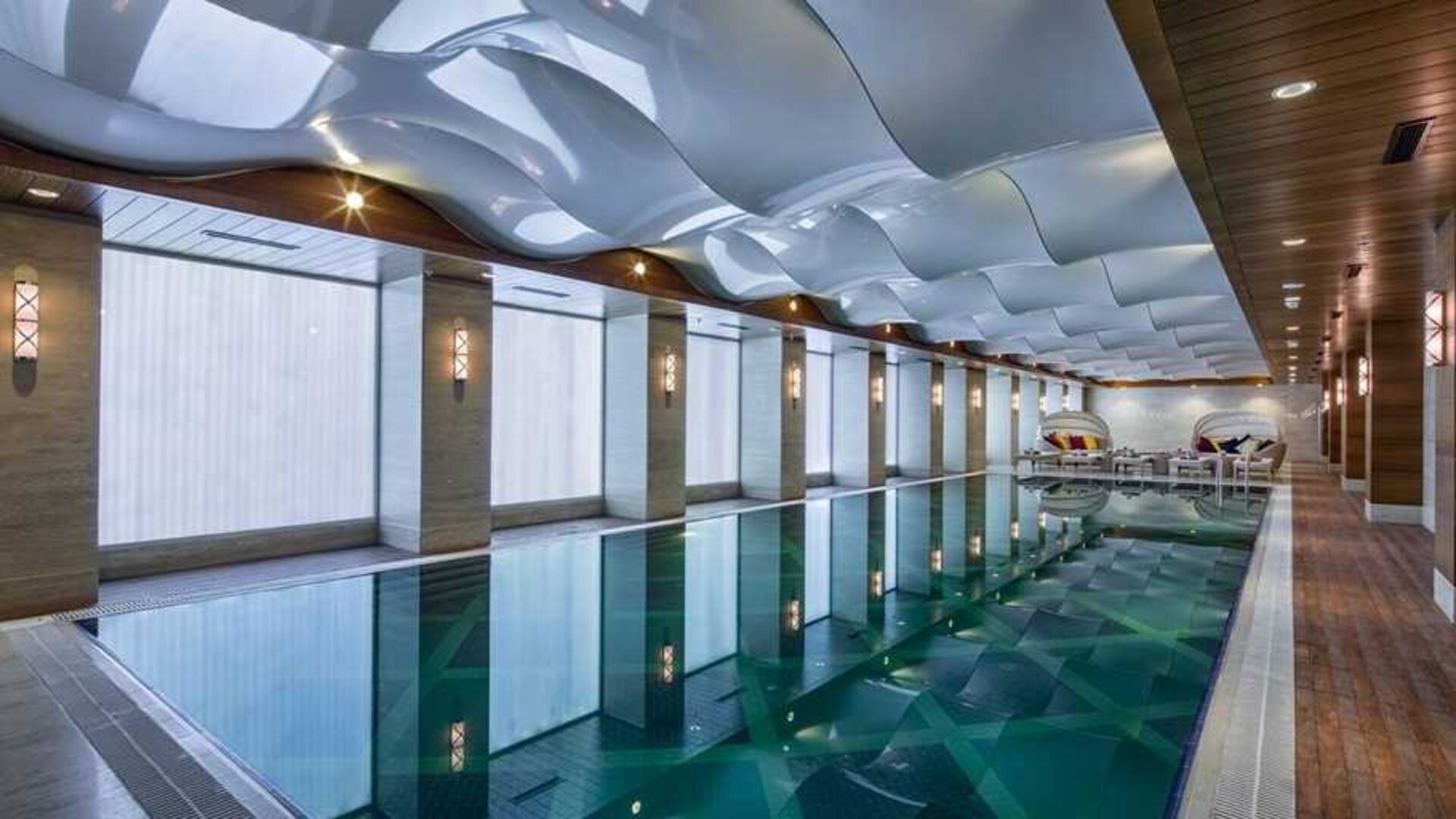 lovely indoor pool with seating area at DoubleTree by Hilton Istanbul Topkapi.