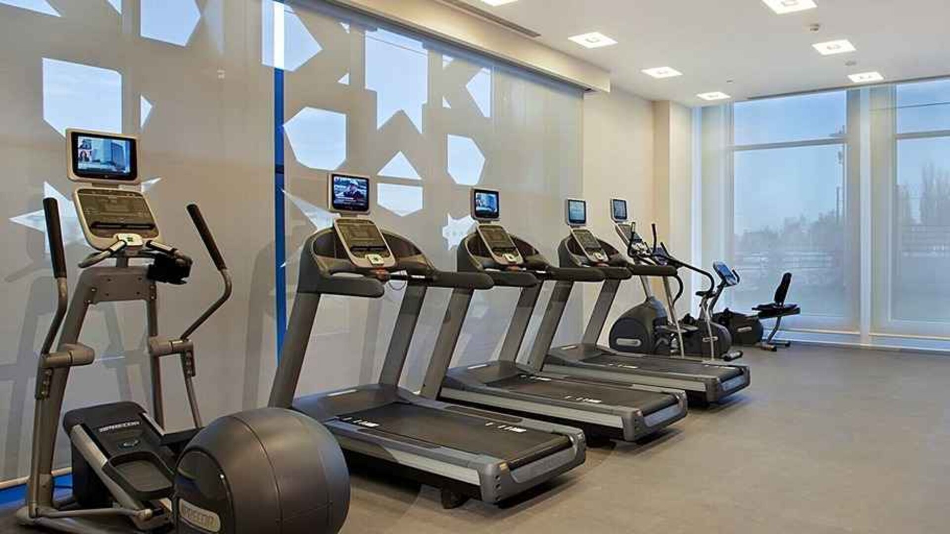 well equipped fitness center with treadmills, step machines, and weights at Hilton Garden Inn Konya, Turkey.