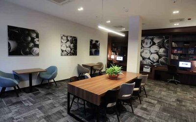 Hotel workspace with large table at the Hampton by Hilton Gdansk Old Town.