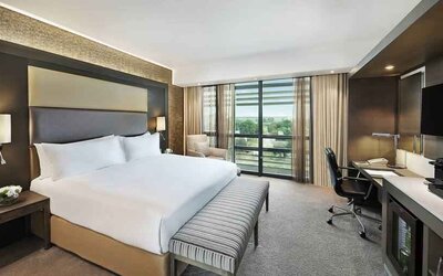 King bedroom with desk at the Legend Hotel Lagos Airport, Curio Collection by Hilton.