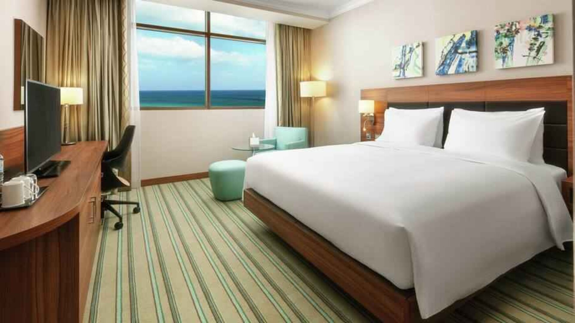 King bedroom with desk at the Hilton Garden Inn Al Jubail.