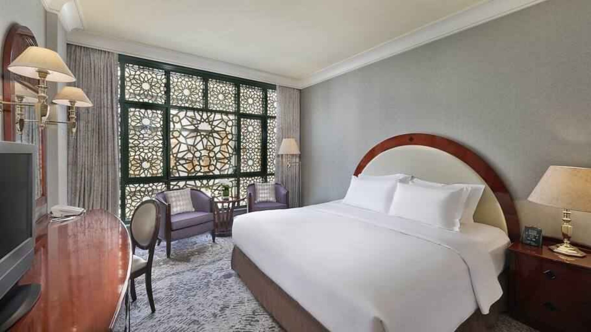 King bedroom with desk at the Madinah Hilton Hotel.